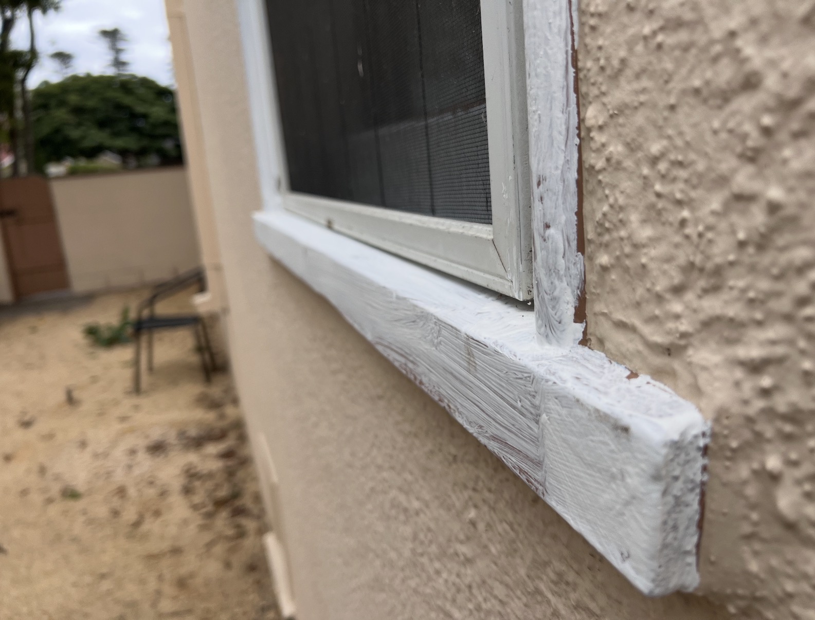 Technician testing painted trim and windows Technician testing painted trim and windows