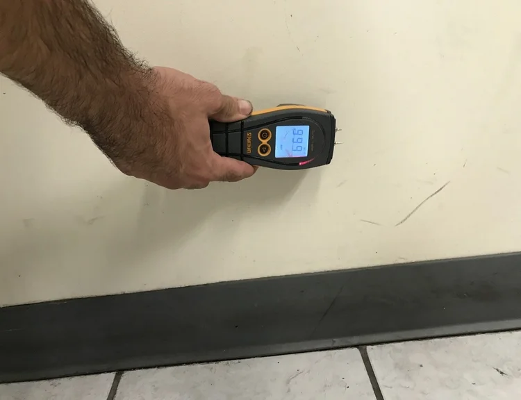 IMG_4164 A person measuring temperature with a digital infrared thermometer